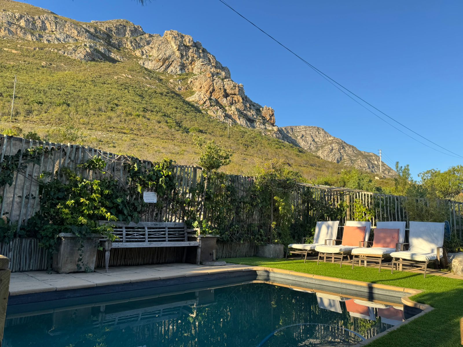 78 on 5th exterior — pool, sun loungers, mountain backdrop, Voelklip Hermanus